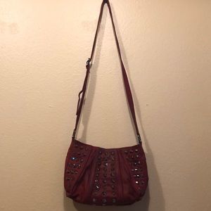 Red leather like cross body purse with studs